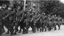 Members of the Milice march through Paris.