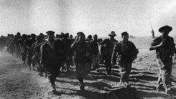 Italian troops taken by the Western Desert Force in December 1940, march in to captivity.